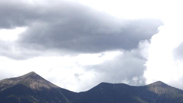Dark clouds over a mountain range