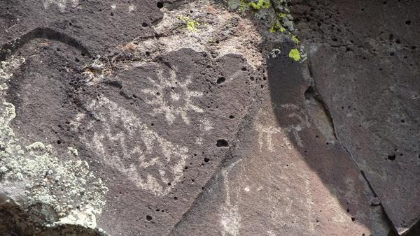 A petroglyph that depicts the sun and a wobbly line that looks like water