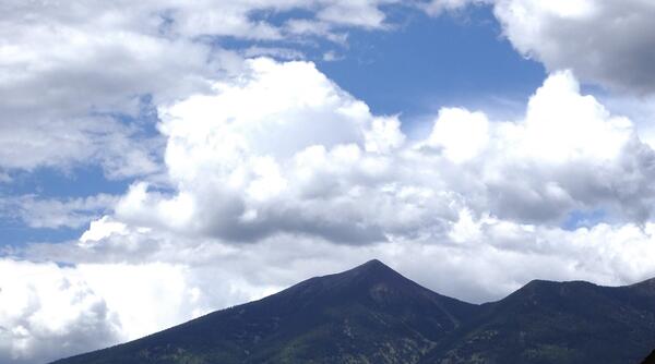 Clouds gather above a mountain range 