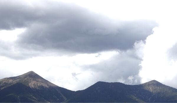 Dark clouds over a mountain range