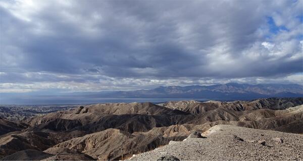 Clouds and a blue sky above a mountain range